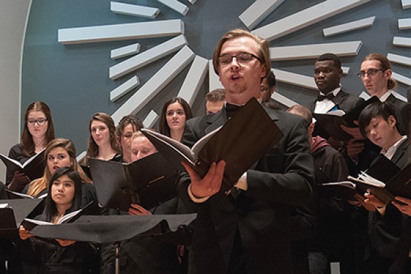 Cody Weldon sings before choir