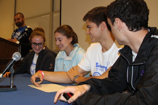 Science Olympians from Assumption College High School wrestle with a question during a fast-paced quiz game in the Toldo Health Education Centre.