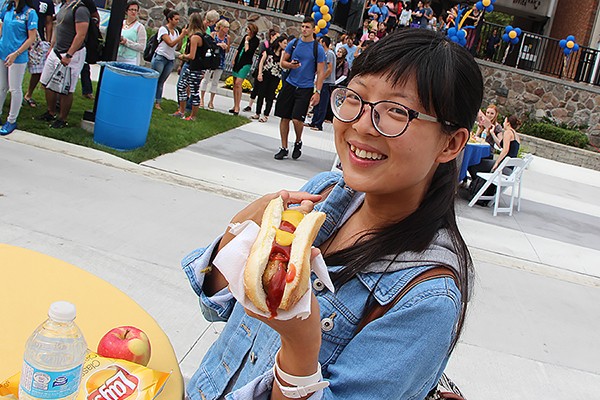 Gemma Zhang holds hotdog