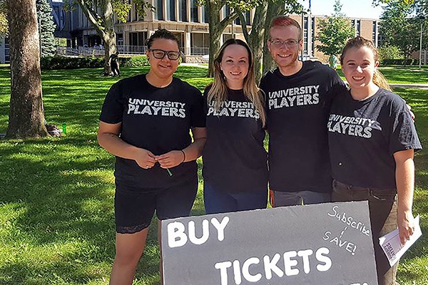 drama students selling University Players tickets