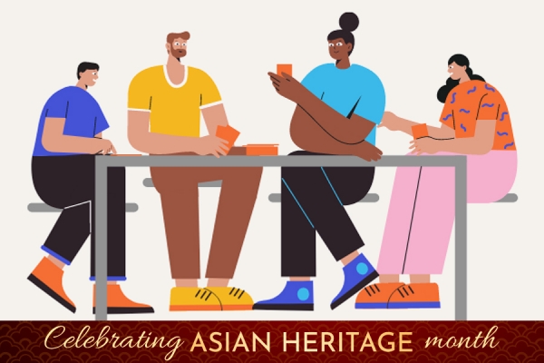 group of varying ethnicities seat above banner reading &quot;Celebrate Asian Heritage Month&quot;