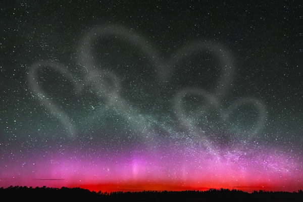 a starlit sky creating the illusion of heart shapes in the Milky Way