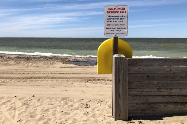 Beach with sign warning posted