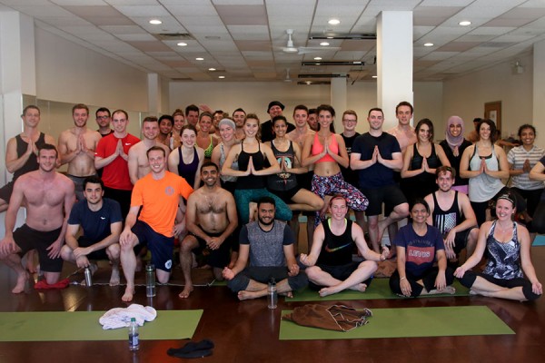 Students in the Odette MBA program strike a pose following a hot yoga class as part of a de-stress day on Monday, May 8.