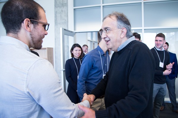 Sergio Marchionne shaking hands with a student