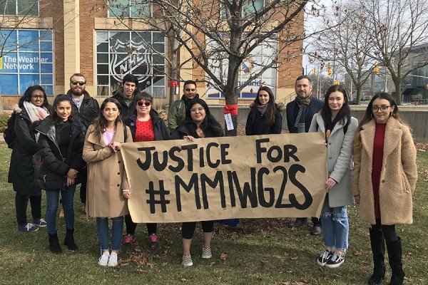 University of Windsor students stand with dean of law Christopher Waters in calling for justice for Missing and Murdered Indigenous Women, Girls, and Two-Spirit people.