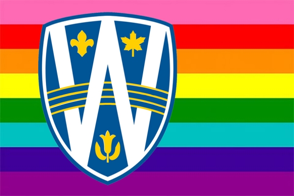 Pride flag with UWindsor shield superimposed