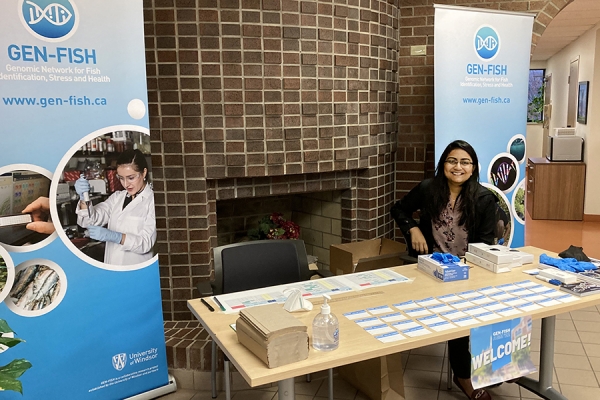 Laboratory technician Keta Patel welcomes registrants to the GEN-FISH annual general meeting.