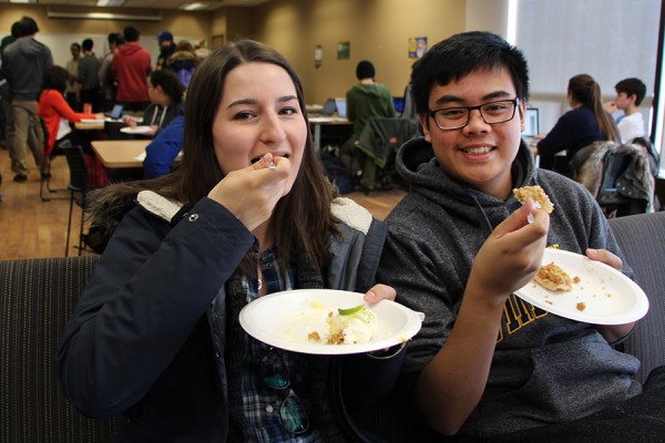 First-year students Kaity Greco and Matthew Tolentino enjoy free pie.