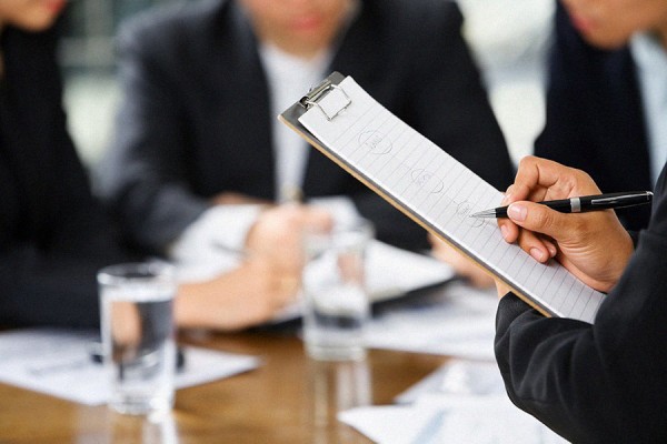 professional holding clipboard