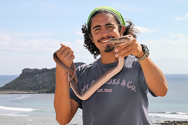 man holding large Mexcian snake