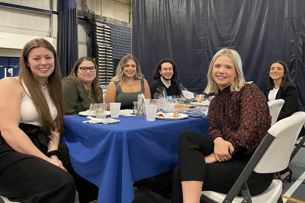 students at table during HK Scholars&#039; Evening