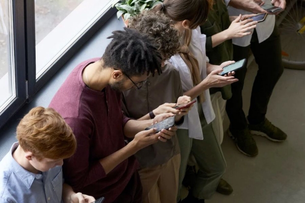 young people absorbed in smartphones