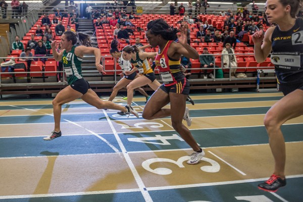 sprinters crossing finish line