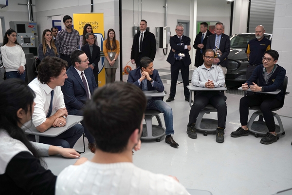 Justin Trudeau sitting in discussion with students