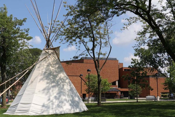 teepee pitched outside law building