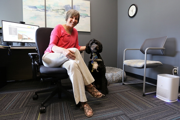 Therapist Giselle St. Louis and therapy dog Winnie