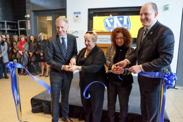 University of Windsor President Alan Wildeman, Marilyn Racotivis, Helena Ventrella and Drew Dilkens cut the ribbon at the grand opening of the School of Creative Arts&#039; Freedom Way Building on March 22, 2018.