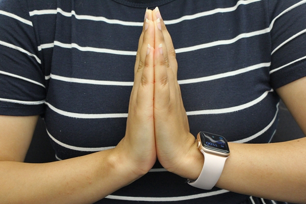 hands clasped in meditation