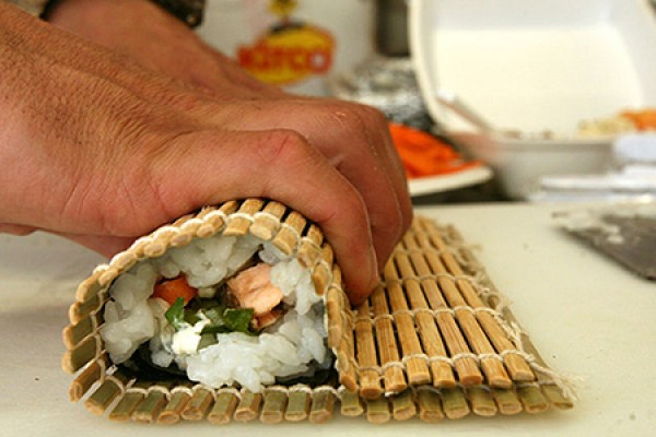 hand rolling sushi