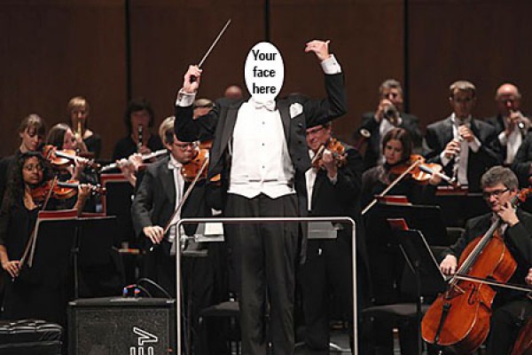 Faceless conductor standing before orchestra