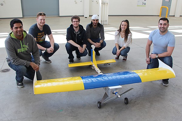 Lancer Aerosports members pose with their completed model aircraft