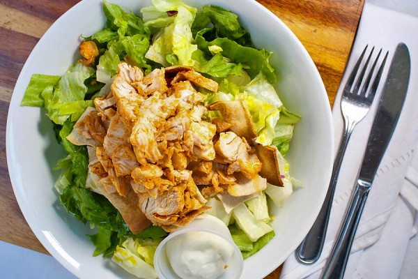 an Adam&#039;s salad: romaine layered with hummus and more