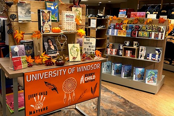 table of books and shelf of products