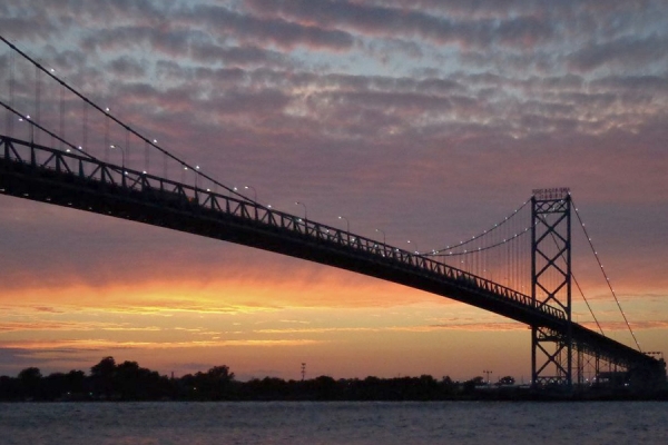 sunset behind bridge