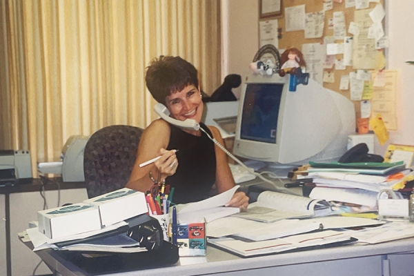 Linda Ruccolo sitting at desk