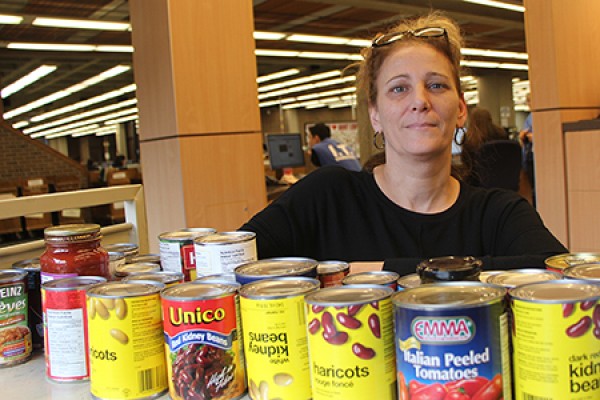 Joann Kolonelos poses with canned goods