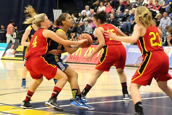 Guard Korissa Williams draws a crowd of Guelph defenders