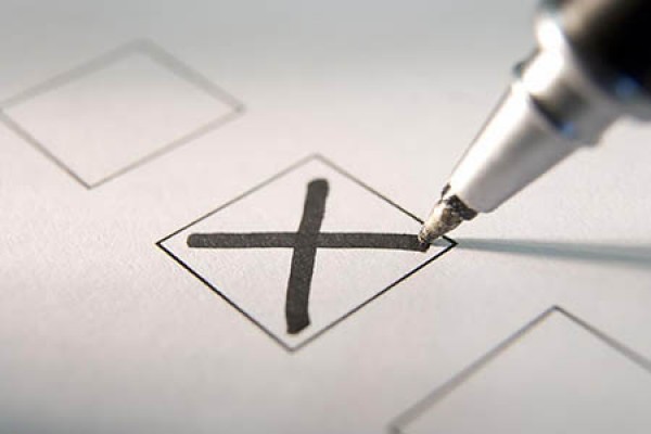 pen marking ballot with X