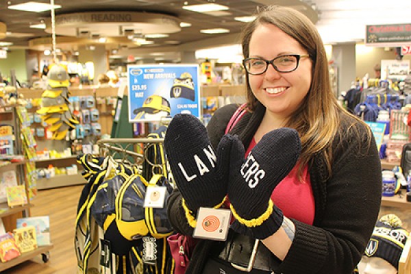 Meg Gregory shows off a pair of Lancers mittens