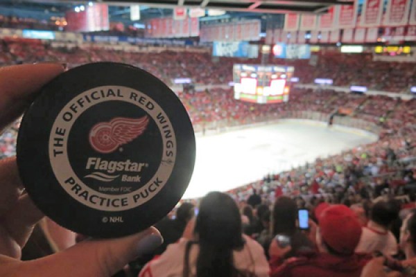 Daniela Bernet holds a souvenir puck