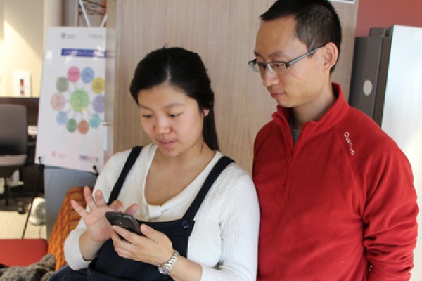 Pregnant woman working with smartphone