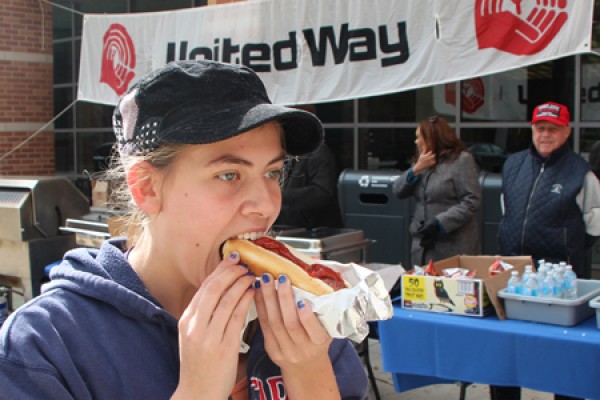 Sarah Kresan eats a hotdog