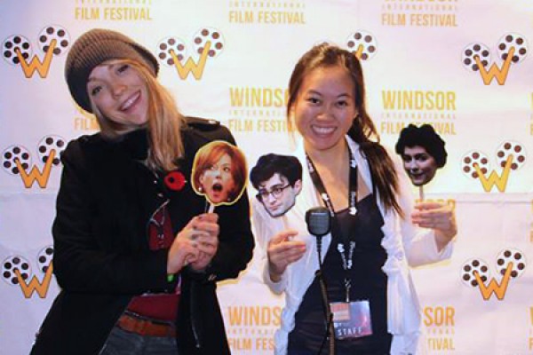 Business students Celina Bussiere and Thuy Doan ham it up on the red carpet