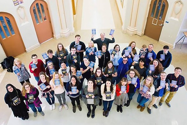 Professor Marty Gervais and students in his publishing practicum course hold copies of the books they helped shepherd to completion.