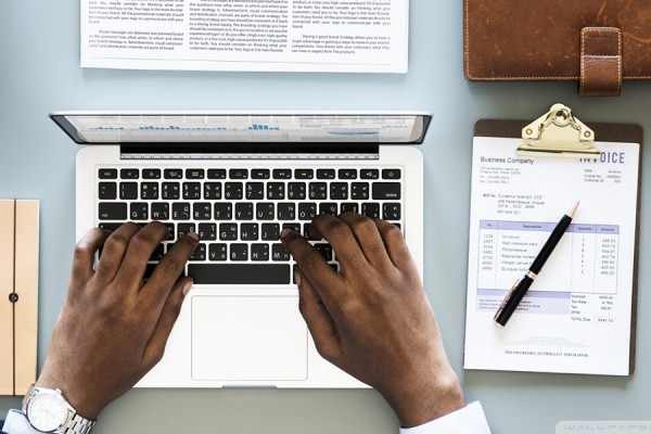 Hands on a computer keyboard