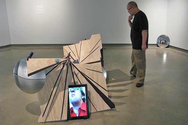 Doug Jarvis regards his sculpture installation “Life Feed.”