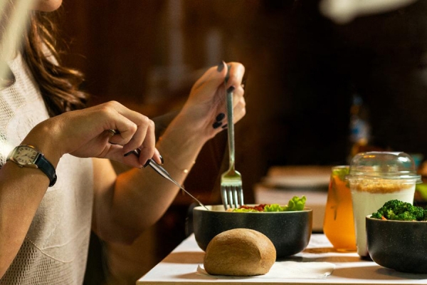 person tucking into healthy meal