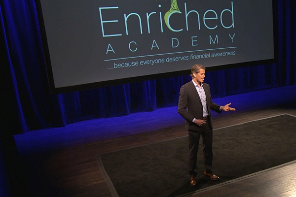 Enriched Academy presenter on stage