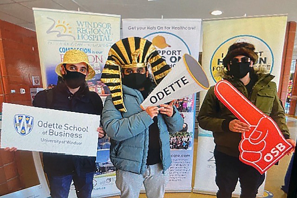 Abdullah Palang, Ameel Yaldako, and Rawad Chahla wearing silly hats