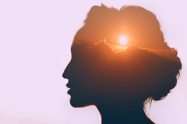 silhouette of head filled with sunrise