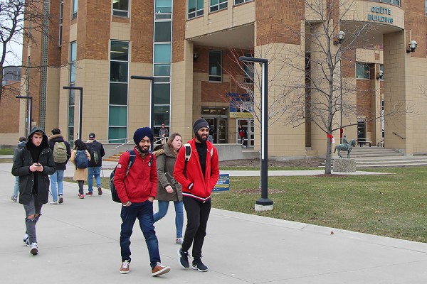 students walking by Odette Building