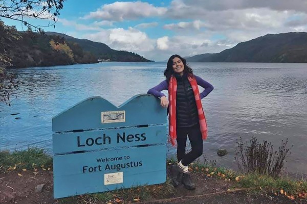 Olivia Sanders standing next to Loch Ness