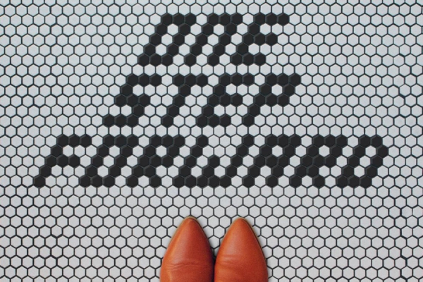 floor tiles spelling out &quot;One Step Forward&quot;