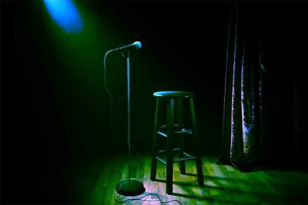 empty stage with spotlight on microphone