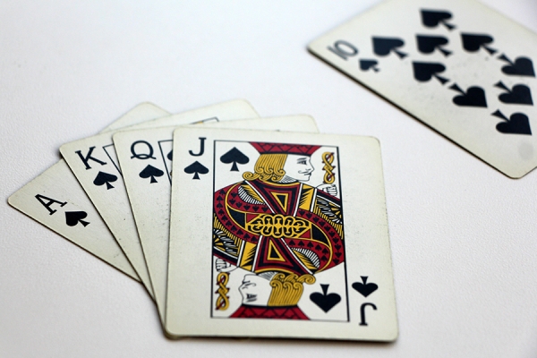 card hand: royal flush. Ace, King, Queen, Jack and 10 of spades